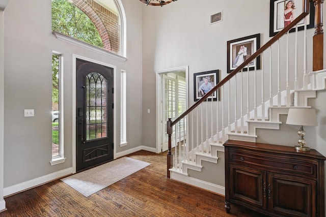 528 Layton Dr, Coppell, TX 75019 - entrance foyer featuring baseboards, stairway, a towering ceiling, and dark wood finished floors