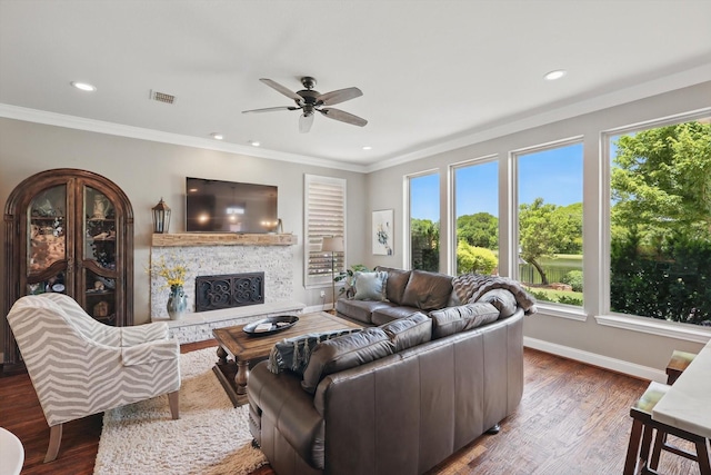528 Layton Dr, Coppell, TX 75019 - living room featuring a ceiling fan, crown molding, a fireplace, baseboards, and wood finished floors