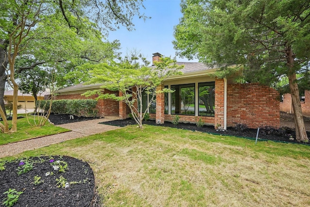6407 Laurel Valley Rd, Dallas, TX 75248 - ranch-style house featuring a front yard, a chimney, and brick siding