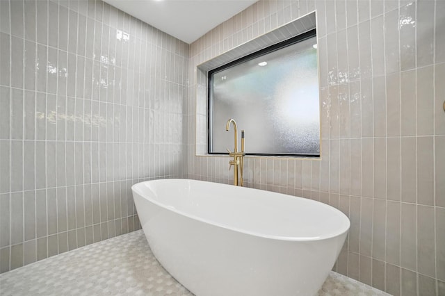 6407 Laurel Valley Rd, Dallas, TX 75248 - bathroom with tile walls and a freestanding bath