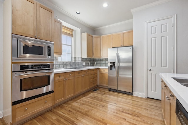 2028 N Haskell Ave, Dallas, TX 75204 - kitchen with appliances with stainless steel finishes, ornamental molding, light countertops, tasteful backsplash, and light wood-style floors