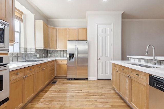 2028 N Haskell Ave, Dallas, TX 75204 - kitchen with stainless steel appliances, a sink, light brown cabinetry, crown molding, and decorative backsplash