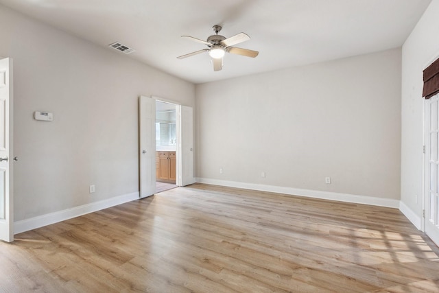 2028 N Haskell Ave, Dallas, TX 75204 - unfurnished bedroom with light wood-style flooring, baseboards, ensuite bath, and a ceiling fan