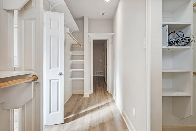2028 N Haskell Ave, Dallas, TX 75204 - walk in closet featuring wood finished floors