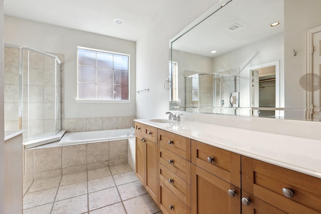 2028 N Haskell Ave, Dallas, TX 75204 - bathroom with a shower stall, a relaxing tiled tub, vanity, and a spacious closet