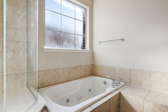 2028 N Haskell Ave, Dallas, TX 75204 - bathroom with healthy amount of natural light, a jetted tub, and a stall shower