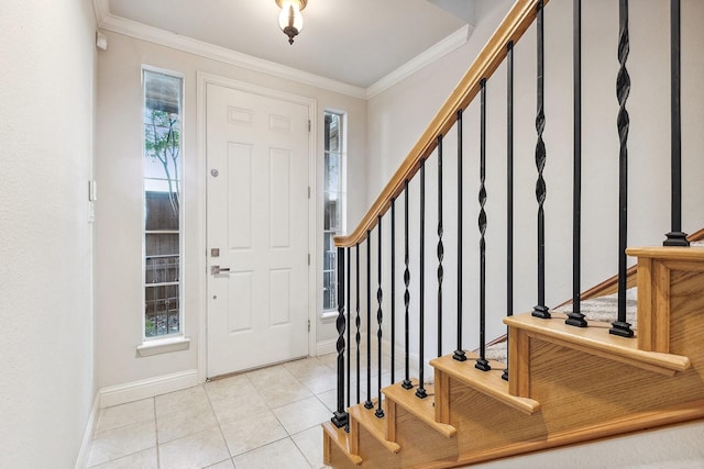 2028 N Haskell Ave, Dallas, TX 75204 - foyer featuring crown molding, light tile patterned flooring, baseboards, and stairway
