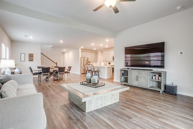 2148 Bellatrix Dr, Haslet, TX 76052 - living room with stairs, light wood finished floors, a ceiling fan, recessed lighting, and baseboards