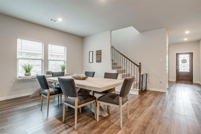 2148 Bellatrix Dr, Haslet, TX 76052 - dining space featuring stairs, wood finished floors, baseboards, and recessed lighting