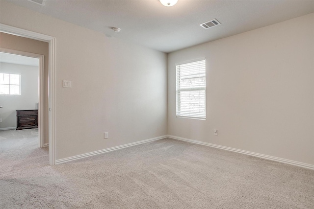 2148 Bellatrix Dr, Haslet, TX 76052 - spare room featuring light carpet, plenty of natural light, baseboards, and a smoke detector