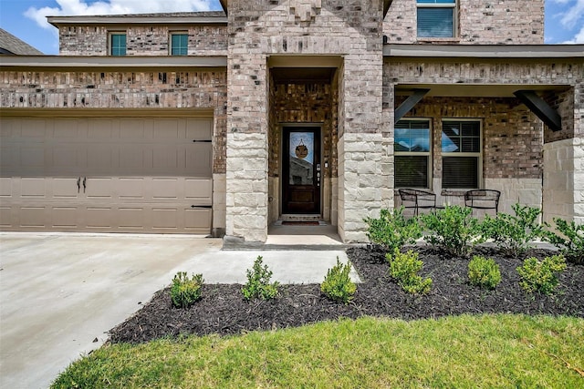 2148 Bellatrix Dr, Haslet, TX 76052 - property entrance with driveway, covered porch, brick siding, and a garage