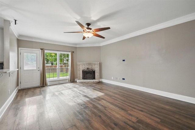 3211 Ruidoso Ln, Mckinney, TX 75070 - unfurnished living room with ceiling fan, ornamental molding, baseboards, dark wood-type flooring, and a fireplace