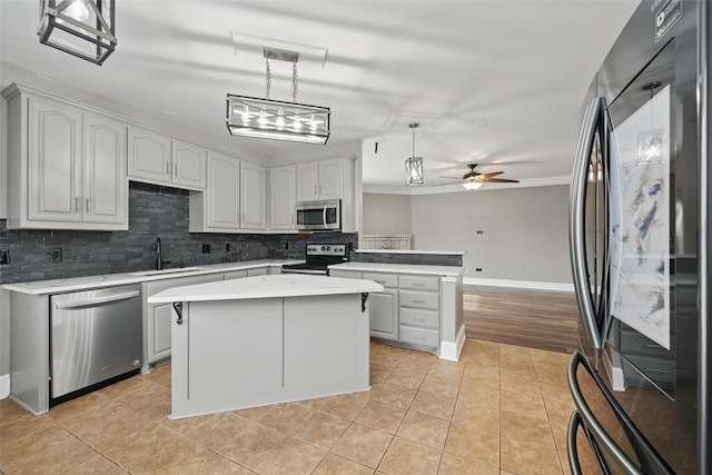 3211 Ruidoso Ln, Mckinney, TX 75070 - kitchen featuring stainless steel appliances, a sink, decorative backsplash, light tile patterned floors, and light countertops