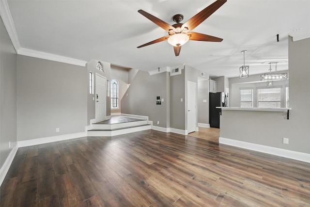 3211 Ruidoso Ln, Mckinney, TX 75070 - unfurnished living room featuring ceiling fan, wood finished floors, baseboards, and ornamental molding