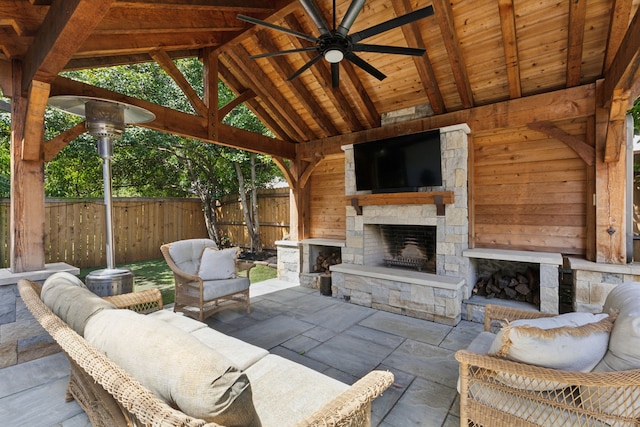569 Dove Creek Cir, Grapevine, TX 76051 - view of patio / terrace featuring a gazebo, fence, an outdoor stone fireplace, and ceiling fan
