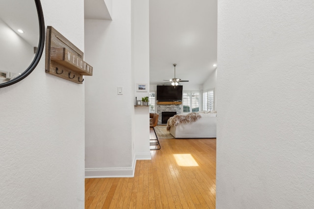 569 Dove Creek Cir, Grapevine, TX 76051 - hallway with hardwood / wood-style flooring, baseboards, and a high ceiling