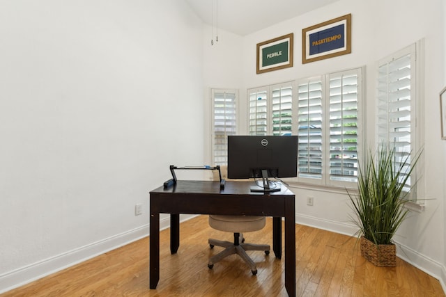 569 Dove Creek Cir, Grapevine, TX 76051 - office area with wood finished floors, baseboards, and a towering ceiling