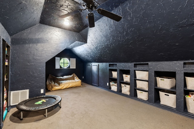 569 Dove Creek Cir, Grapevine, TX 76051 - carpeted cinema room with lofted ceiling, a ceiling fan, and built in shelves