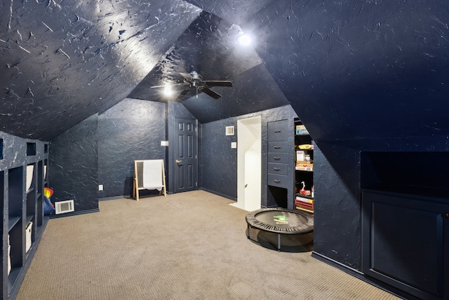 569 Dove Creek Cir, Grapevine, TX 76051 - carpeted cinema with vaulted ceiling and a ceiling fan