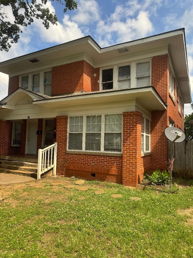 410 Egan St, Shreveport, LA 71101 - view of home's exterior featuring crawl space, brick siding, and covered porch