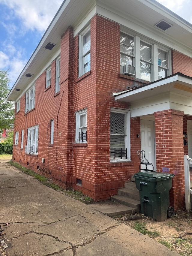 410 Egan St, Shreveport, LA 71101 - view of side of home with brick siding, crawl space, and cooling unit