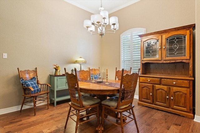 128 Creek Rdg, Waco, TX 76708 - dining area featuring a chandelier, crown molding, wood finished floors, and baseboards