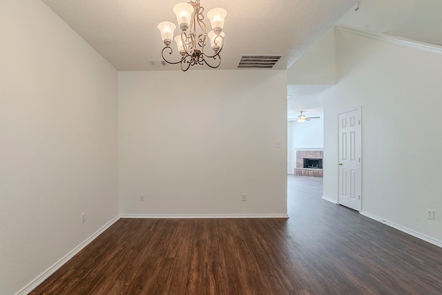 4617 Barnhill Ln, Fort Worth, TX 76135 - spare room featuring dark wood-style flooring, a chandelier, and baseboards
