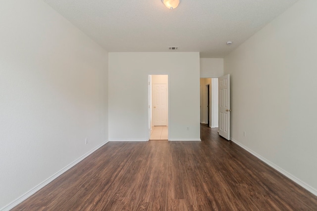 4617 Barnhill Ln, Fort Worth, TX 76135 - empty room with dark wood-type flooring and baseboards