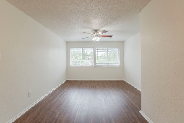 4617 Barnhill Ln, Fort Worth, TX 76135 - unfurnished room featuring dark wood-style flooring, a ceiling fan, a textured ceiling, and baseboards