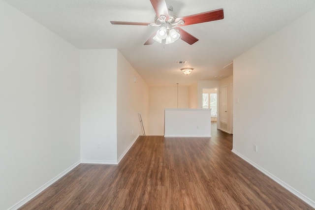4617 Barnhill Ln, Fort Worth, TX 76135 - spare room featuring wood finished floors, baseboards, and a ceiling fan