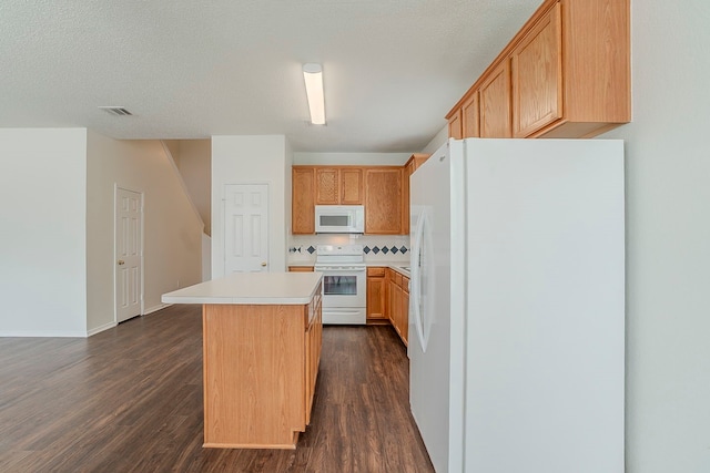 4617 Barnhill Ln, Fort Worth, TX 76135 - kitchen featuring white appliances, dark wood-type flooring, a kitchen island, light countertops, and baseboards