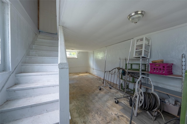 6058 Golden Gate Dr, Dallas, TX 75241 - basement featuring stairs and wood finished floors