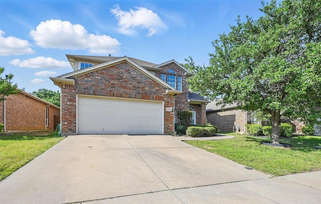 2668 Silver Hill Dr, Fort Worth, TX 76131 - traditional home with a front lawn, driveway, brick siding, and an attached garage