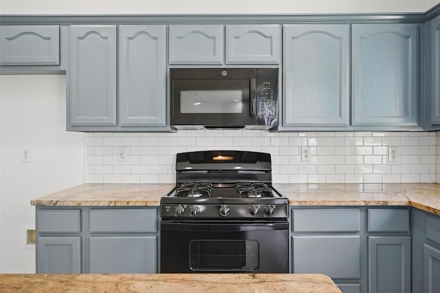 2668 Silver Hill Dr, Fort Worth, TX 76131 - kitchen with black appliances, backsplash, and light stone counters
