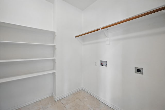 2668 Silver Hill Dr, Fort Worth, TX 76131 - laundry area with electric dryer hookup, washer hookup, baseboards, and light tile patterned floors