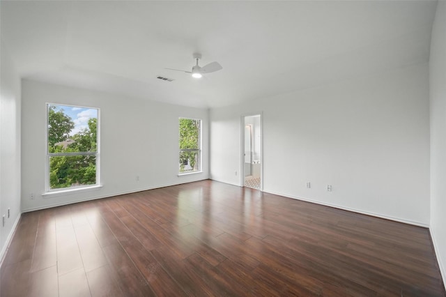2668 Silver Hill Dr, Fort Worth, TX 76131 - unfurnished room featuring plenty of natural light, a ceiling fan, dark wood-style floors, and baseboards