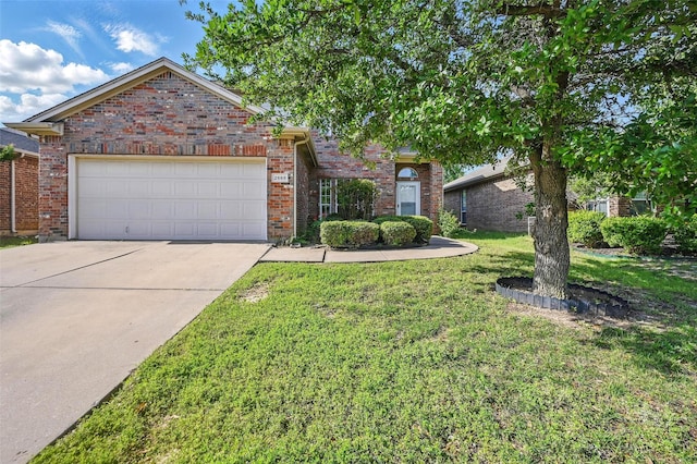 2668 Silver Hill Dr, Fort Worth, TX 76131 - view of front of home featuring driveway, a front lawn, an attached garage, and brick siding