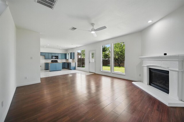 2668 Silver Hill Dr, Fort Worth, TX 76131 - unfurnished living room featuring a ceiling fan, a high end fireplace, baseboards, and recessed lighting