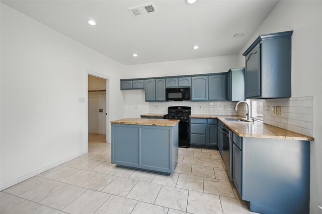2668 Silver Hill Dr, Fort Worth, TX 76131 - kitchen with black appliances, a sink, a kitchen island, backsplash, and recessed lighting