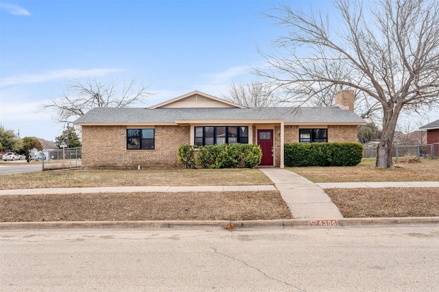 4306 Frog Dr, Killeen, TX 76542 - view of front of home with brick siding, a chimney, and roof with shingles