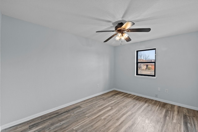 4306 Frog Dr, Killeen, TX 76542 - empty room with wood finished floors, baseboards, and ceiling fan