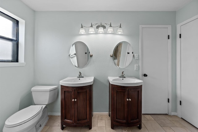 4306 Frog Dr, Killeen, TX 76542 - bathroom featuring two vanities and toilet