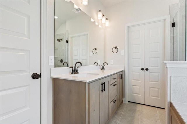 514 Geyser Trl, Waco, TX 76657 - full bathroom featuring tiled shower, tile patterned flooring, and double vanity