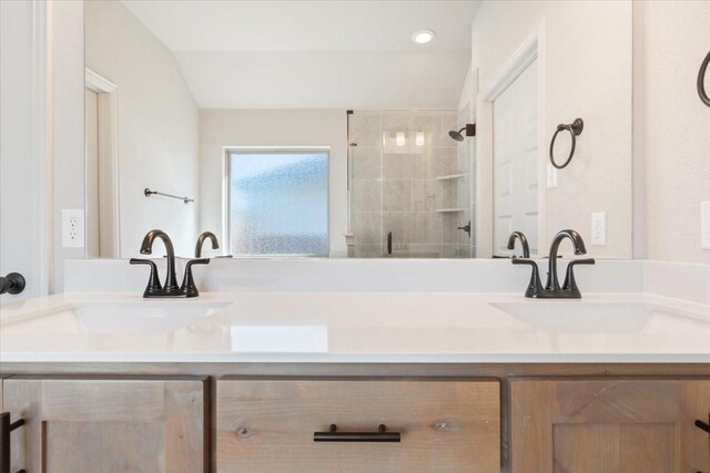 514 Geyser Trl, Waco, TX 76657 - bathroom with double vanity, a tile shower, and recessed lighting
