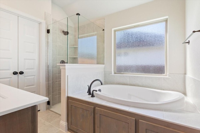 514 Geyser Trl, Waco, TX 76657 - bathroom featuring a stall shower, a garden tub, and tile patterned flooring