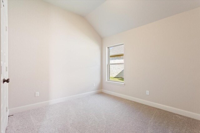 514 Geyser Trl, Waco, TX 76657 - spare room with carpet floors, lofted ceiling, and baseboards