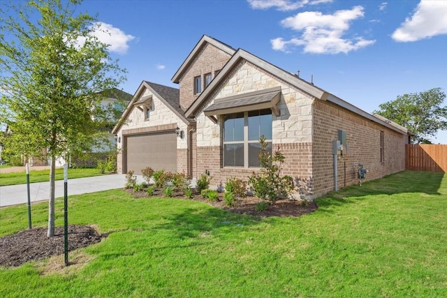 514 Geyser Trl, Waco, TX 76657 - view of front facade with stone siding, a garage, concrete driveway, and brick siding