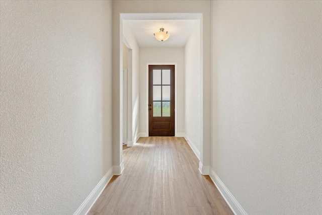 514 Geyser Trl, Waco, TX 76657 - entryway with wood finished floors, a textured wall, and baseboards