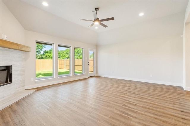 514 Geyser Trl, Waco, TX 76657 - unfurnished living room featuring ceiling fan, light wood-style flooring, a premium fireplace, baseboards, and recessed lighting