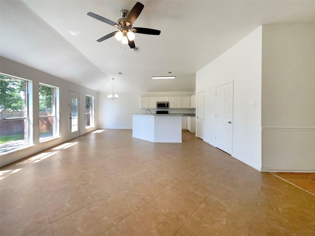 603 Jamie Ln, Mansfield, TX 76063 - unfurnished living room with lofted ceiling, a chandelier, ceiling fan, and light tile patterned floors